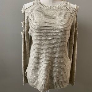 Sweater with sleeve cutouts